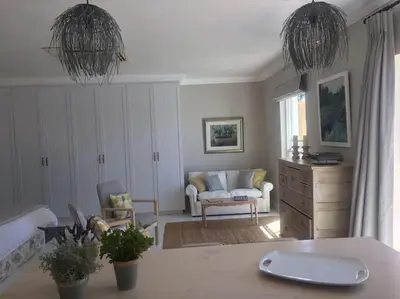 a living room with a couch and a table at Camberley Wines - Luxury Accommodation in Stellenbosch