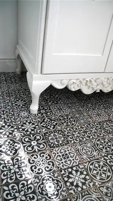 a room with a floor with a white dresser at Daisy Place in Franschhoek