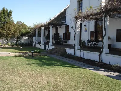 a white house with a lawn in front of it at Panorama Self Catering 2 in Panorama