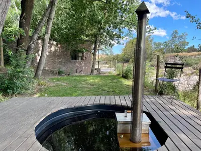 a plunge pool on a wooden deck with a pole at UnderHill Farm in Klipkraal
