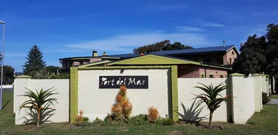 a building with a sign that says art did not make at Port Del Mar Guesthouse in Hermanus