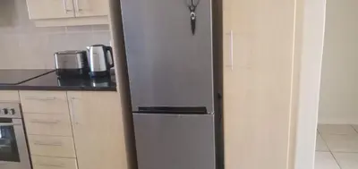 a stainless steel refrigerator in a kitchen at Bougain Villas in Cape Town