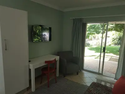 a room with a desk and a chair and a window at Besigheim in Stellenbosch