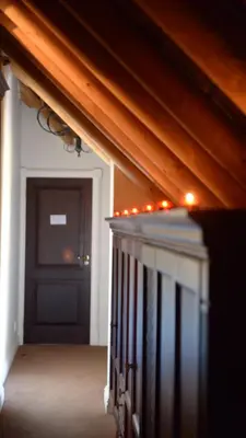 a hallway with a staircase with a door and lights at Ridgemor Villa in Somerset West