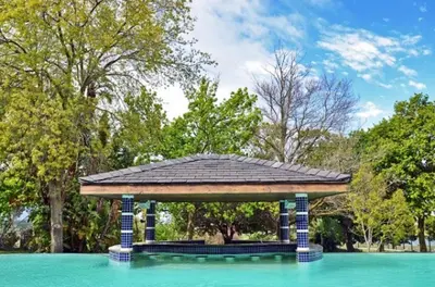 a gazebo in the middle of a pool of water at Ridgemor Villa in Somerset West