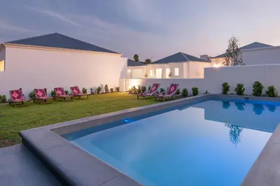 a swimming pool in the backyard of a house at Perla in Hermanus