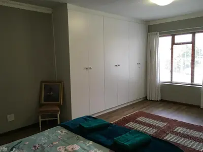 a bedroom with a bed and a window at 18 Patrys Crescent in Hermanus