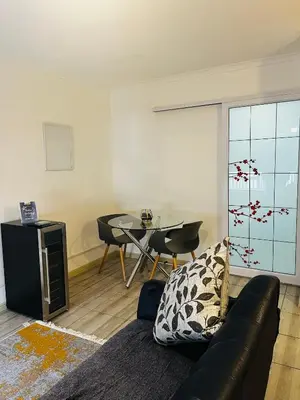 a living room with a couch and a table at Modern secure apartment in Strand - Little Greece in Strand