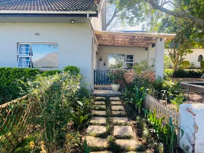 a house with a pathway leading to the front door at Winelands guest room in Stellenbosch