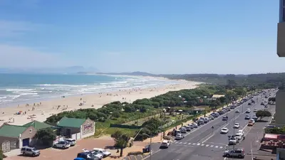 a view of a beach with cars parked at 604 St Tropez in Strand