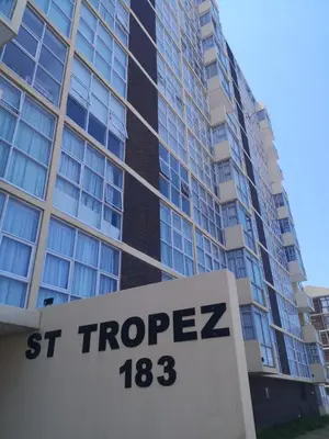 a st properties sign in front of a building at 604 St Tropez in Strand