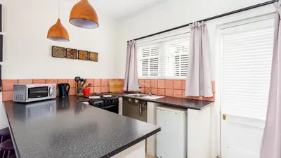 a kitchen with a counter top and a microwave at Lady Loch Country House in Wellington