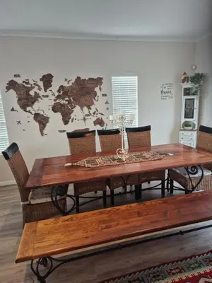 a dining room table with chairs and a map on the wall at HERMANUS , SANDBAAI holiday house in Hermanus