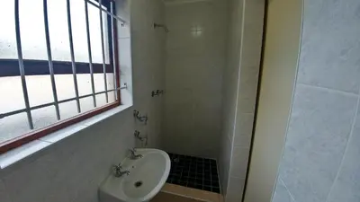 a bathroom with a toilet and a sink and a shower at Blouberg Beach Retreat in Bloubergstrand