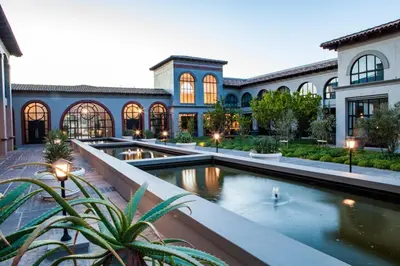 an exterior view of a building with a pool at Santé Wellness Retreat & Spa in Paarl