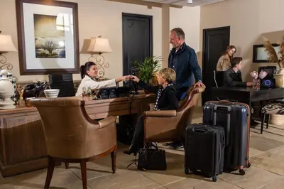 a group of people sitting around a table with luggage at Santé Wellness Retreat & Spa in Paarl