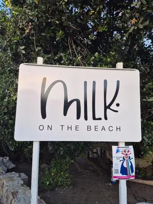 a sign for a hotel on the beach at Nerf-af ROOMS at Onrus , Hermanus in Hermanus