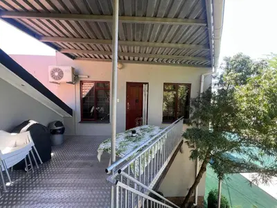 a balcony of a house with a bed on it at 3 on Nebraska Accommodation in Bellville