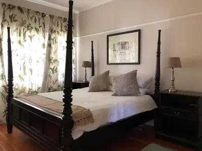 a bedroom with a four poster bed and a window at Becketts Bliss in Worcester