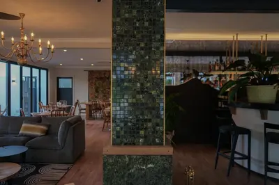 two images of a restaurant with a bar and a lobby at Vrede en Lust Estate in Simondium