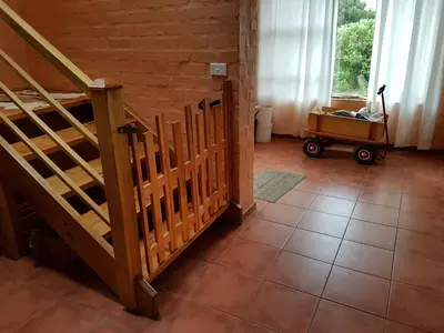 a room with a staircase and a tiled floor at Pelagonia in Bettyʼs Bay