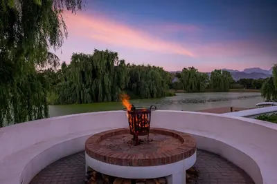a fire pit with a fire extinguisher in the middle at The Residence @ Vrede & Lust in Franschhoek