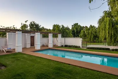 a swimming pool in the yard of a house at The Residence @ Vrede & Lust in Franschhoek