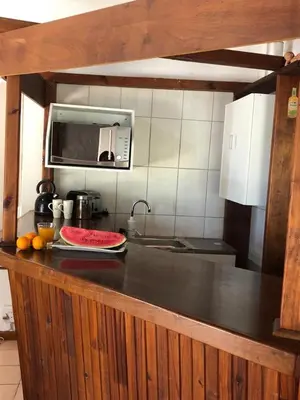 a kitchen with a counter top with a microwave at The Vineyard View in Joostenberg Vlakte