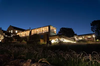 a house lit up at night at De Zeven Guest Lodge in Stellenbosch