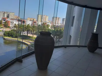 two large black vases sitting in a room with a window at Home relaxation in the city in Cape Town