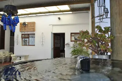 a room with a table in the middle of a building at Worcester Gallery Cottage in Worcester