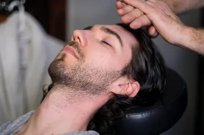 a man getting his hair washed at a hair salon at Gaia Hydro-Spa and Guest House in Cape Town