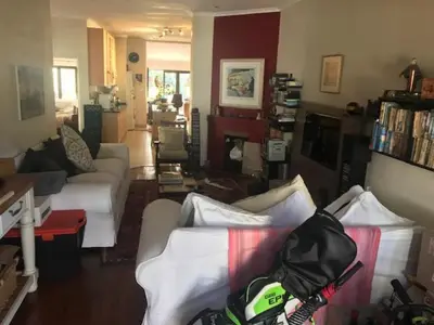 a living room with two couches and a living room with at At 27 on Derby in Cape Town