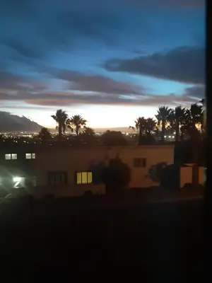 a view of the sunset from a house at On Yonder Hill in Cape Town