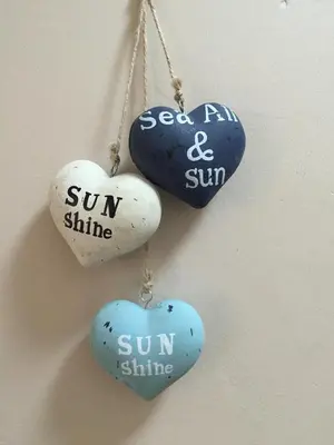 three heart ornaments with the words sun and sun shine at C-Rus in Strand