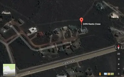 an overhead view of a parking lot with a red arrow pointing to a house at Mountain Mist in Bettyʼs Bay