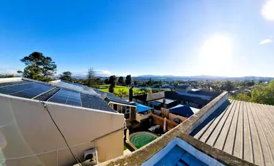 an image of a house with solar panels on the roof at Walters Lane Luxury Accommodation main house - No loadshedding in Cape Town