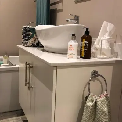 a bathroom counter with a sink and a bottle of soap at The Lemon Tree in Franschhoek in Franschhoek