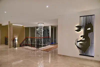 a painting of a face on a wall in a building at Val Du Charron Wine & Leisure Estate in Wellington