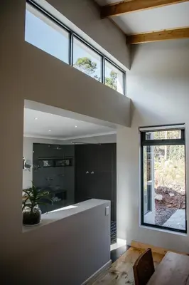 a bathroom with a large window and a large mirror at Opstal Stay in Rawsonville