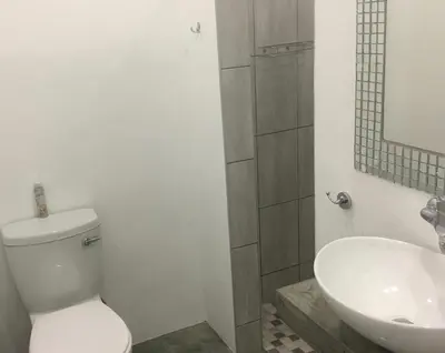 a bathroom with a toilet and a sink at Ammabed Accommodation in Caledon