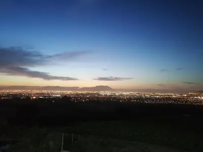 a view of a city at night at Stellar Guest Villa on Stunning Wine Farm in Cape Town