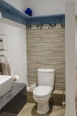 a bathroom with a toilet and a sink at Somerset View Guest House in Somerset West