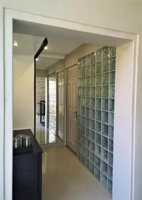 a hallway with a wall of glass wine bottles at Franschhoek Studio in Franschhoek