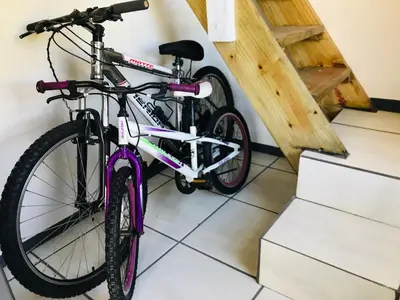 a bike parked in a room next to some stairs at Kleine Vrede Farm Cottage in Hermanus