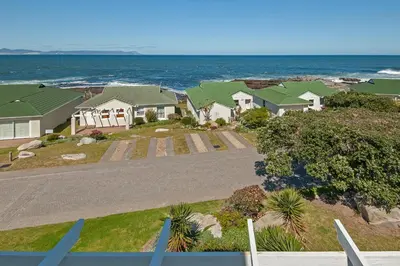 an aerial view of a house near the ocean at 49 Whalerock in Hermanus