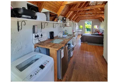 a kitchen with a counter and a sink in a room at Studio on McLeod - Private Self-catering Apartment in Somerset West