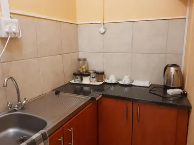 a kitchen with a sink and a counter top at Canterbury Self-catering in Bellville