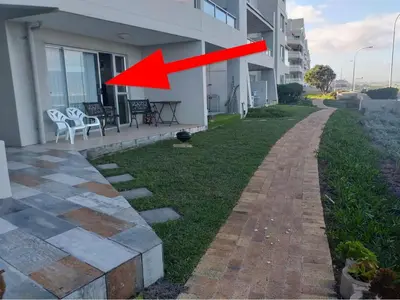 a red arrow is pointing to a house at Sea Spray in Bloubergstrand