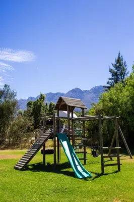 a playground with a slide and a slideintend at Steenbok Farm Cottages Steenbok cottage in Wolseley